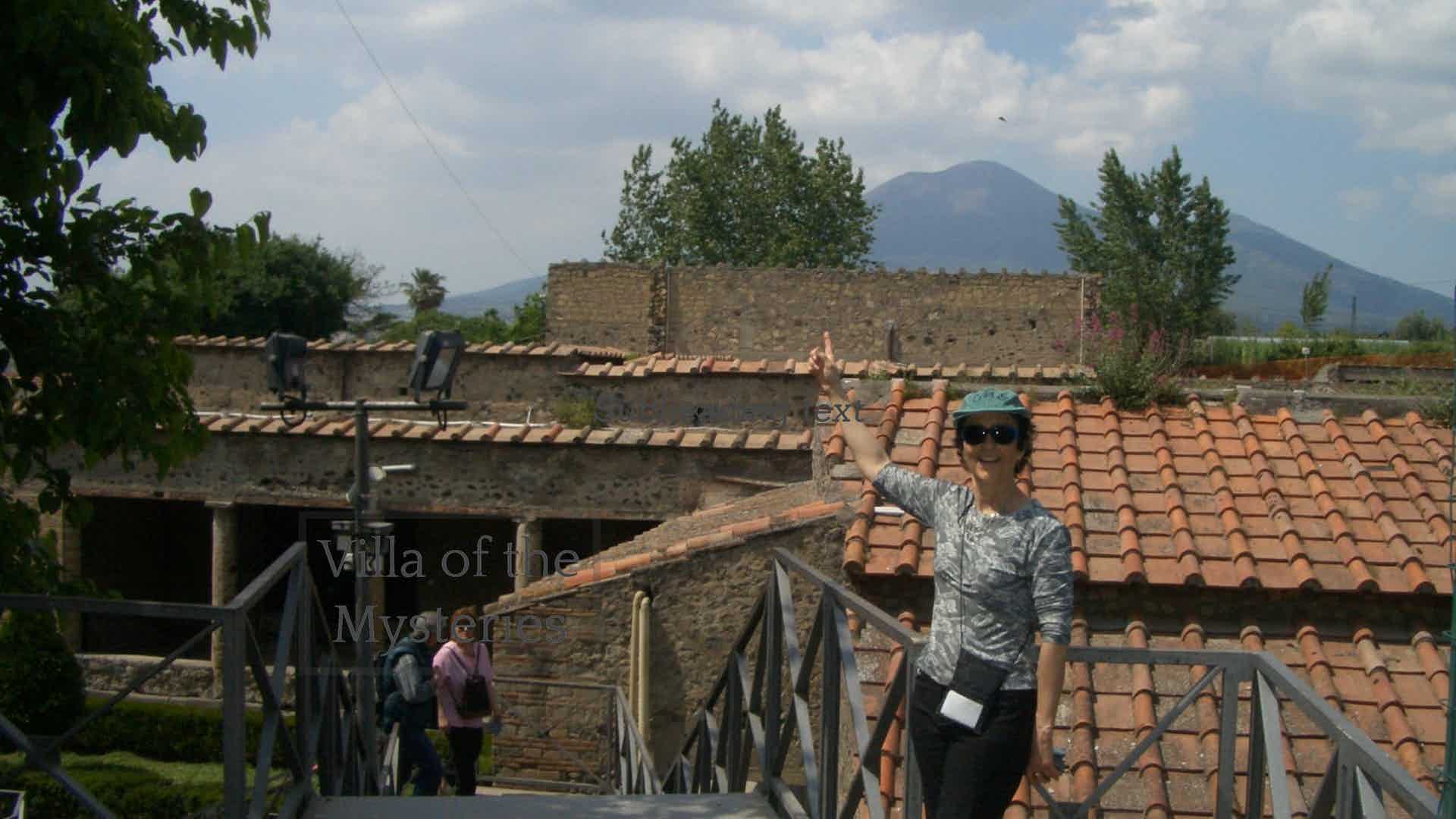 Mary pointing toward Vesuvius near the Villa of the Mysteries.
