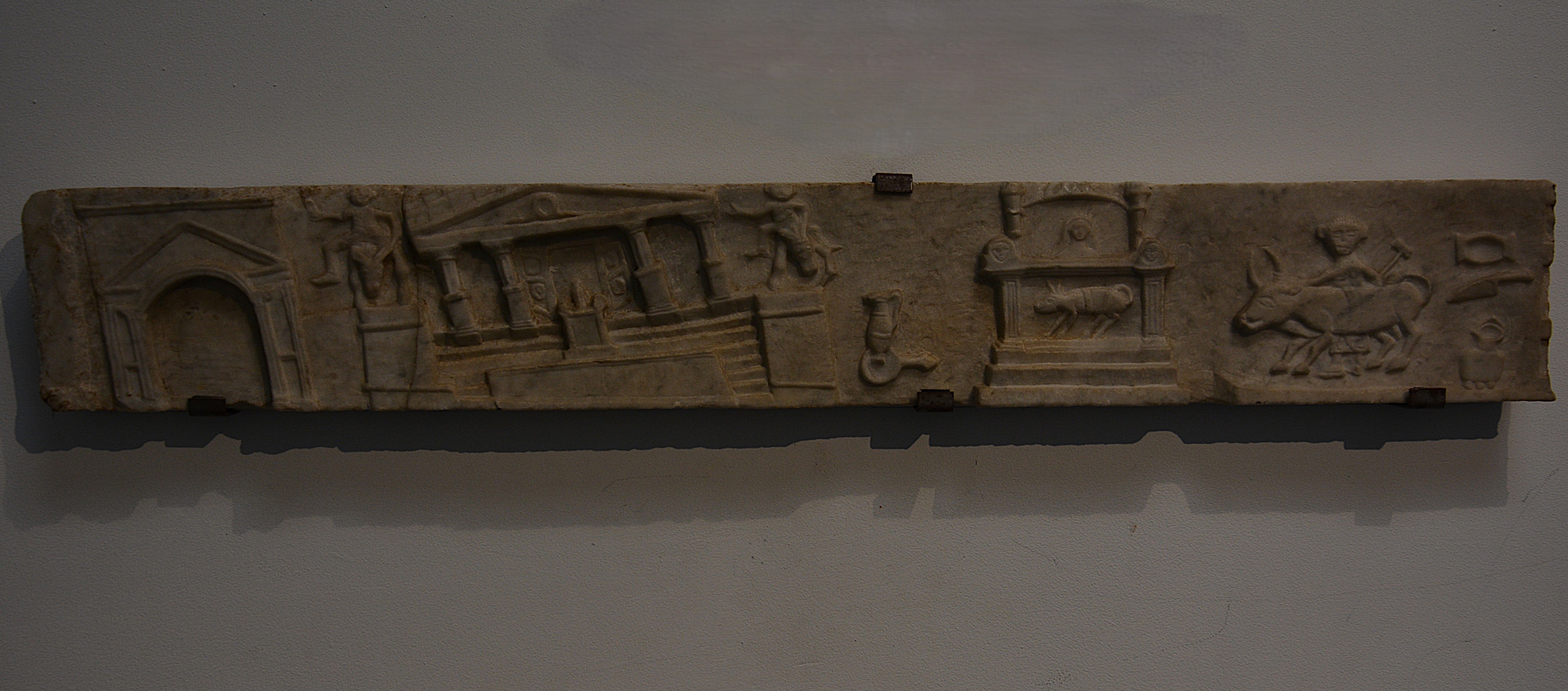 Marble relief showing buildings in the Forum tilting during the earthquake of AD 62 or 63.